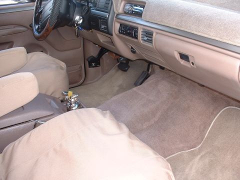 1994 Ford Bronco - Interior view of a 1994 Ford Bronco, highlighting the dashboard and seating area.