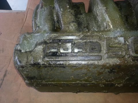 1994 Ford Bronco - This engine part displays the 'FORD' logo, but it is not identifiable as a 1994 Ford Bronco.