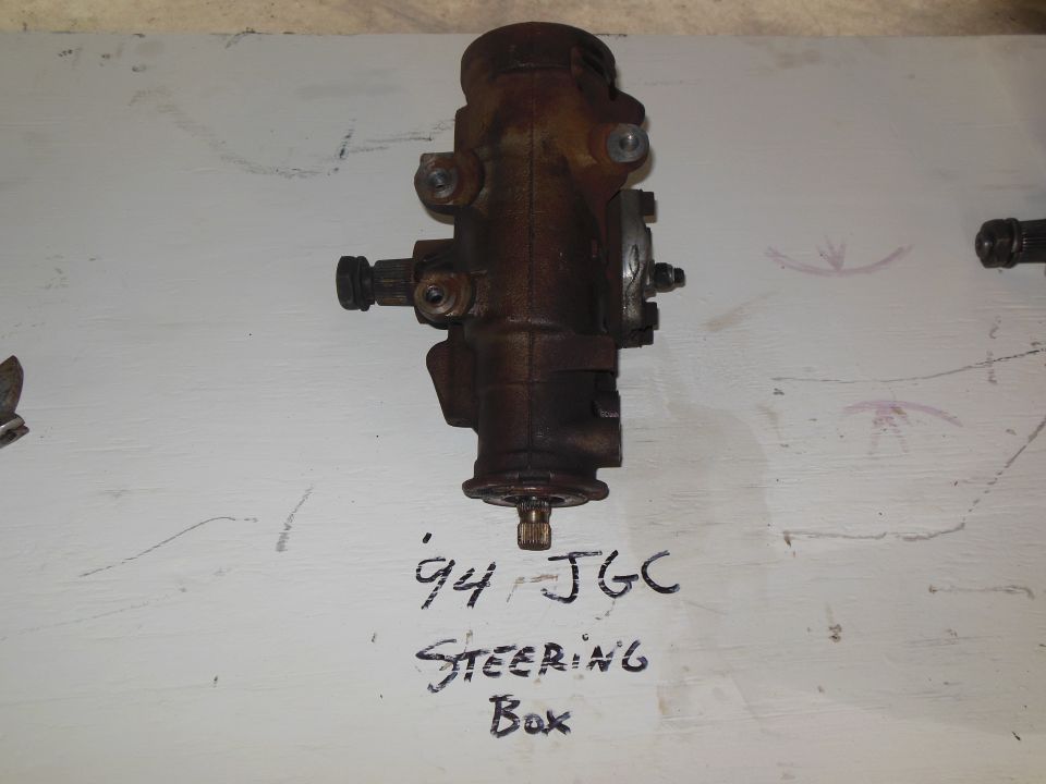 Steering box with '94 JGC Steering Box written on the surface