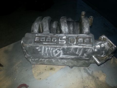 1994 Ford Bronco - A close-up of a Ford 5.0L engine intake manifold, likely a replacement part.