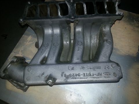 1994 Ford Bronco - This is a Ford intake manifold, likely for a truck or SUV, with part number RF-FOTE-9425-BA.