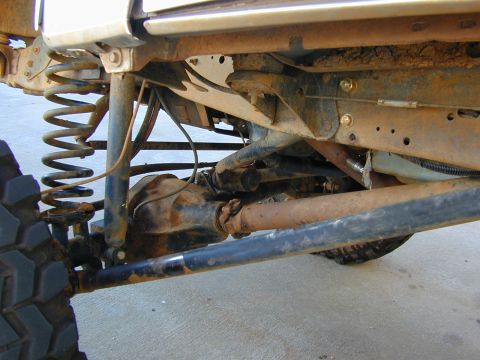 1996 Ford Bronco - Undercarriage view of a 1996 Ford Bronco, showing suspension and drivetrain details.