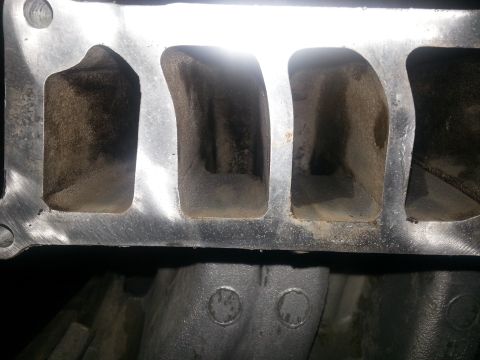 1994 Ford Bronco - Intake manifold ports are visible in this close-up view of a vehicle part.