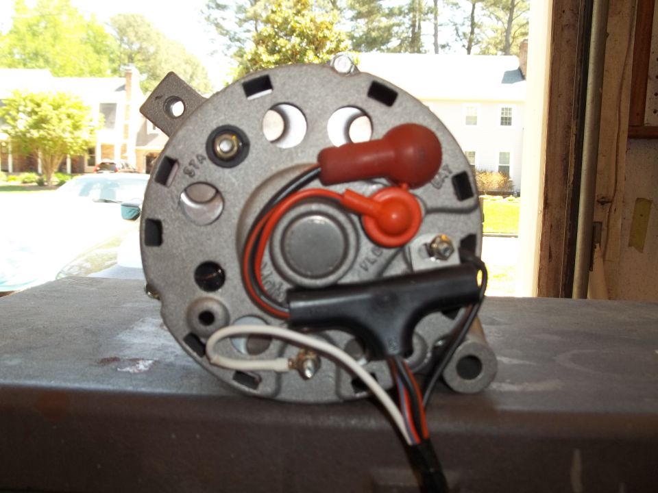 Alternator with red and black wires connected, showing "STA" and "VOLTS" markings