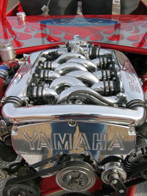 1993 Ford Taurus - Custom engine bay a Yamaha SHO engine with chrome accents and Ford branding.