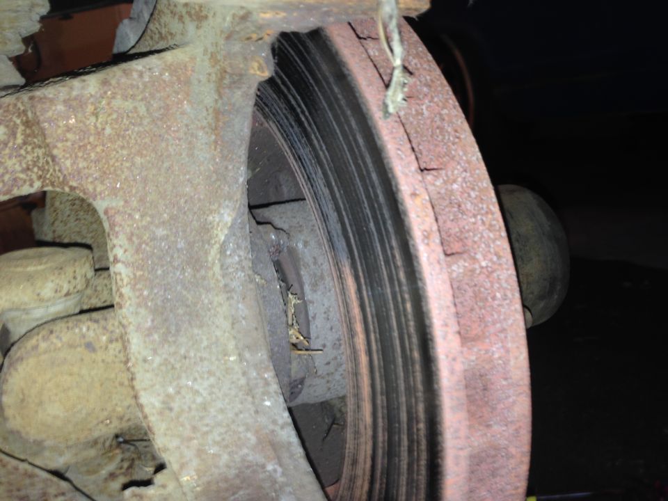 Rusted brake rotor and caliper assembly