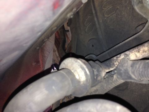 1996 Ford Bronco - Close-up view of exhaust pipes and suspension components, with a Supermotors.net logo visible at the bottom right.