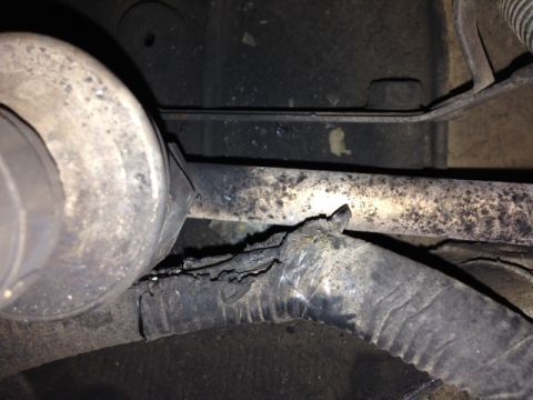 1996 Ford Bronco - Close-up of a damaged wire harness with exposed wires and frayed insulation.