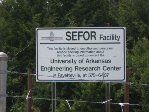 2006 Suzuki DR-Z400S - Sign indicates SEFOR Facility is closed to unauthorized personnel and provides contact info for University of Arkansas.