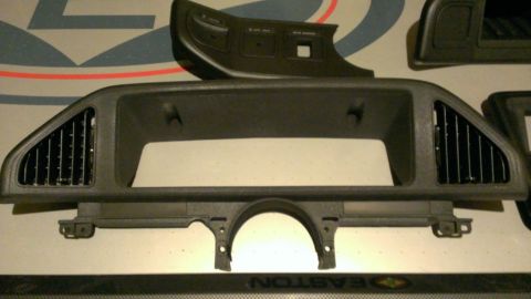 1988 Ford Bronco - Dashboard trim piece with air vents and mounting points, likely for an older vehicle.