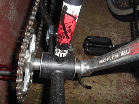 BMX bike frame with chain, pedals, and 'Forkchops BMX' decal