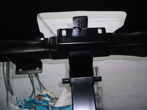 1967 Ford Mustang - Close-up view of a black painted chassis component, likely part of a vehicle's undercarriage.