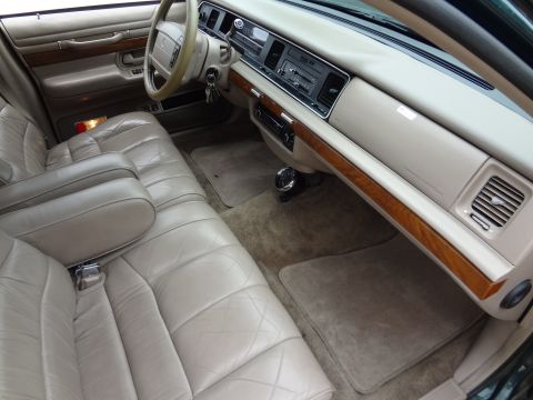 1993 Mercury Grand Marquis - Interior view of a 1993 Mercury Grand Marquis, highlighting its tan leather seats and dashboard details.