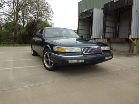 1993 Mercury Grand Marquis - Front view of a 1993 Mercury Grand Marquis sedan with custom wheels.