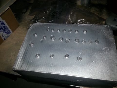 1994 Ford Bronco - This is an aluminum box with multiple bolts fastened to its top surface.