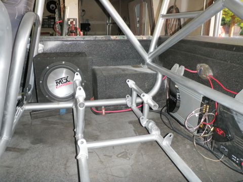 1961 International Scout 800 - Custom roll cage and audio system installed in a vehicle's interior.