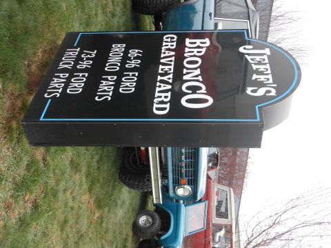 1995 Ford Bronco - A sign for Jeff's Bronco Graveyard is displayed in front of several Ford Broncos.