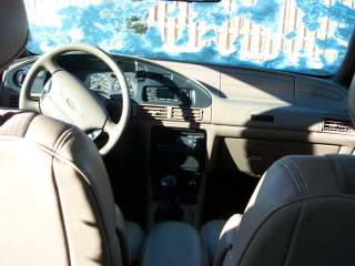 1994 Ford Taurus - Interior view of a car, showing the dashboard, steering wheel, and seats.