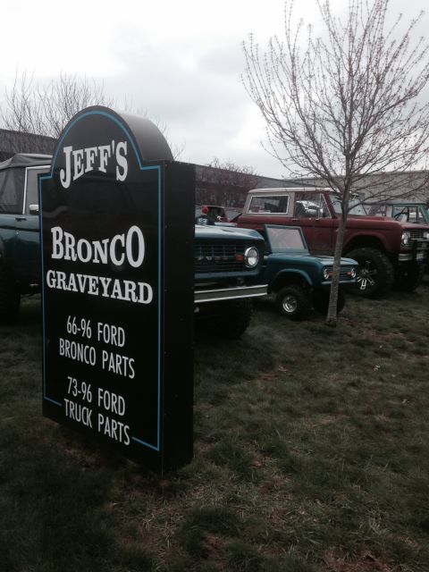 1995 Ford Bronco - A sign for Jeff's Bronco Graveyard advertises parts for 1966-1996 Ford Broncos and 1973-1996 Ford trucks, with several Broncos parked behin…