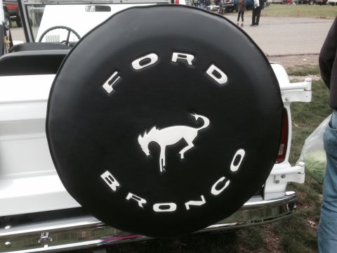 1995 Ford Bronco - Spare tire cover displays the Ford Bronco name and iconic horse emblem.