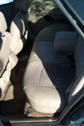 1994 Ford Taurus - Interior view of a car's back seat and a portion of the front seats.