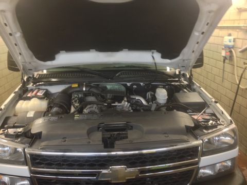 2006 Chevrolet Silverado 2500 - Engine bay of a 2006 Chevrolet Silverado 2500, showing the engine and surrounding components.