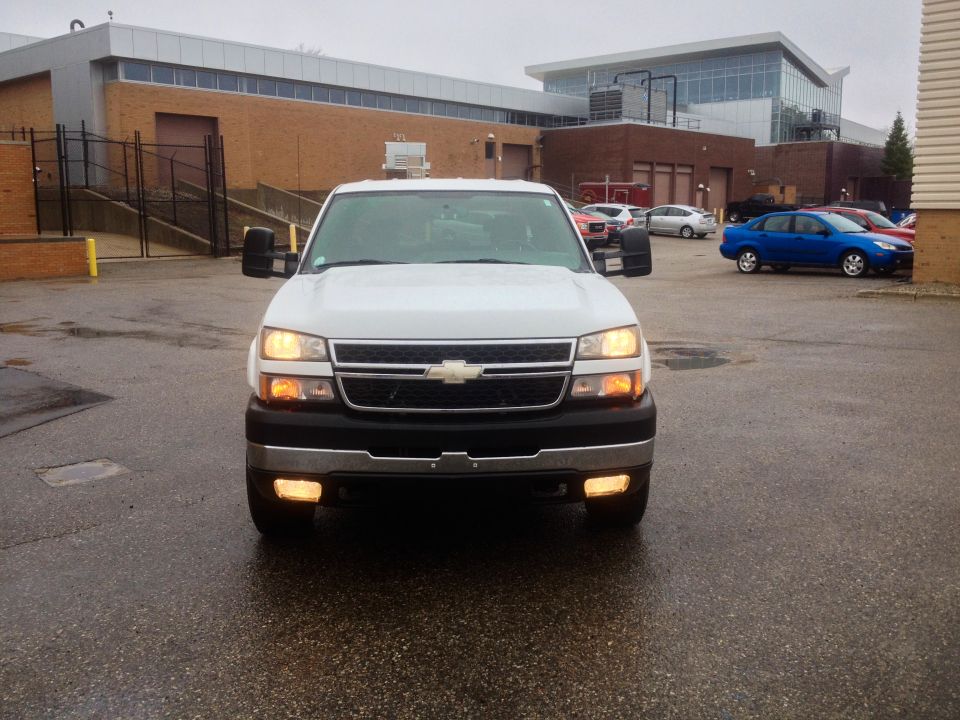 Front view of a white 2006 Chevrolet Silverado 2500 truck
