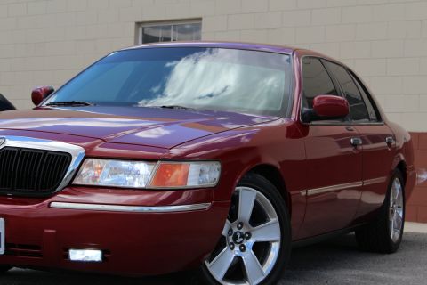 2002 Mercury Grand Marquis - This 2002 Mercury Grand Marquis is shown from a 3/4 front angle, highlighting its chrome grille and headlights.