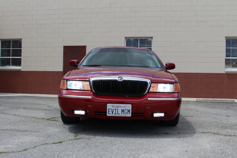 Red 2002 Mercury Grand Marquis front view with California license plate EVIL MGM