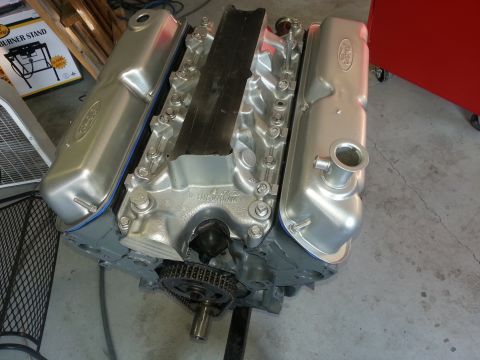 1994 Ford Bronco - A silver Ford V8 engine is shown, with a black intake manifold and silver valve covers.