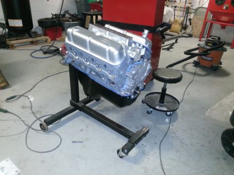 1994 Ford Bronco - Engine on a stand in a workshop setting, ready for installation or rebuild.