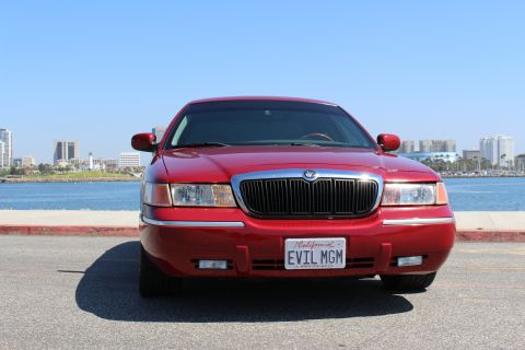 2002 Mercury Grand Marquis - Front view of a red 2002 Mercury Grand Marquis with a custom license plate.