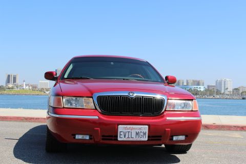 2002 Mercury Grand Marquis - Front view of a red 2002 Mercury Grand Marquis with a custom license plate.