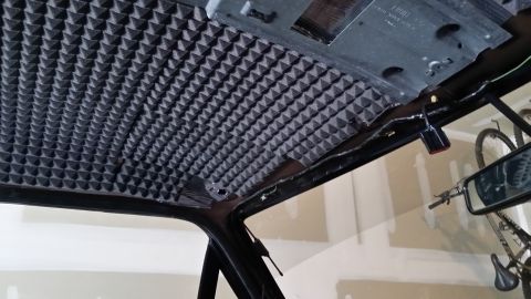 1994 Ford Bronco - Soundproofing foam is applied to the headliner of the vehicle's interior.