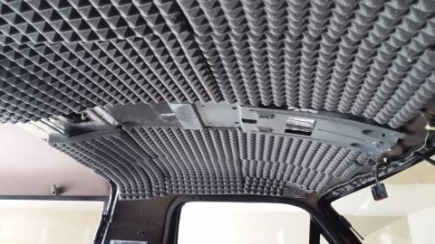 1994 Ford Bronco - Soundproofing foam installed on the interior ceiling of a vehicle.
