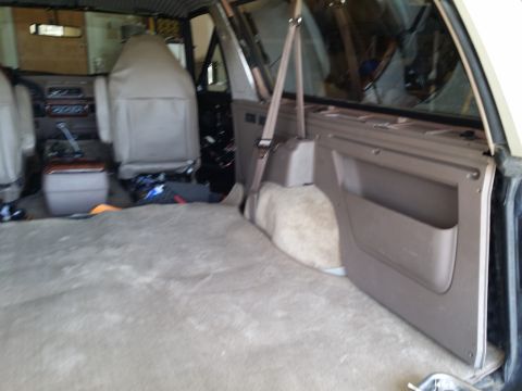 1994 Ford Bronco - The interior of a 1992 Ford Bronco, showing the rear cargo area and front seats.