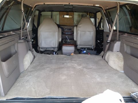 1994 Ford Bronco - Disassembled interior of a 1992 Ford Bronco, showing exposed panels and removed carpeting.