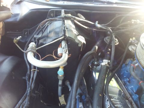 1976 Ford Ranchero - This image shows the air conditioning system components within a vehicle's engine compartment.