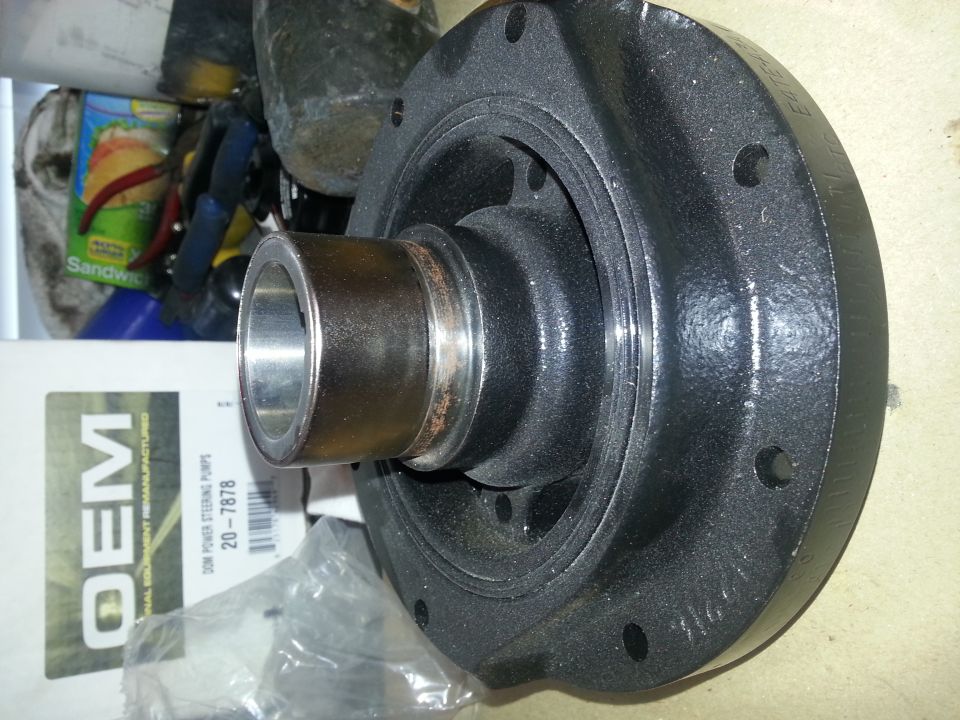 Crankshaft pulley with a metal sleeve and bolt holes