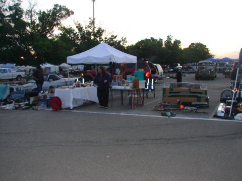 1973 Ford Ranchero - Vendors display items at tables under a tent, with various vehicles and other stalls visible in the background.