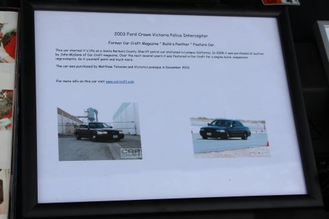 2003 Ford Crown Victoria - Framed car-show placard describing the history of a 2003 Crown Victoria Police Interceptor feature car.