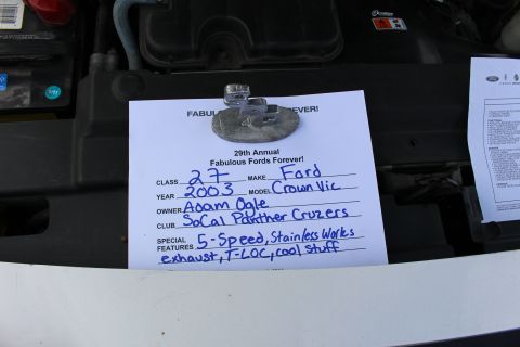 2003 Ford Crown Victoria - Handwritten car-show entry card noting class, make, year, owner and features, not a technical document.