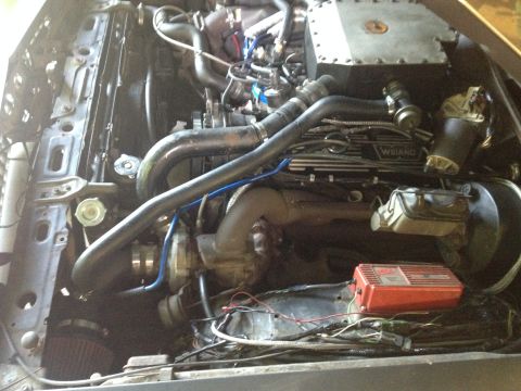 1981 Ford LTD - Driver's side turbo with the finished air intake. Routed the blow off valve to the intake. That's an upper radiator hose for an 83 Buick Ce…