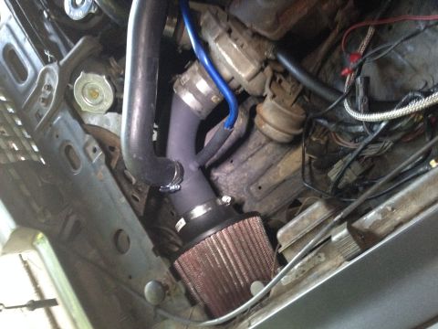 1981 Ford LTD - Driver's side air intake. MIG welder makes adding bits of steel easy. Barbecue paint dries very fast and is a nice flat black.