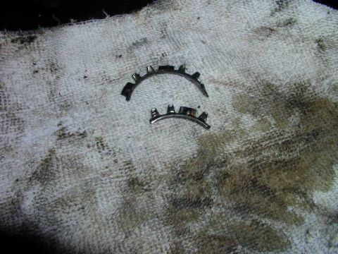 1979 Ford Bronco - Engine bearing shells resting on a dirty rag, likely after removal or installation.