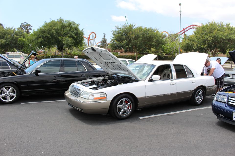 Two-tone white and gold Mercury Grand Marquis with hood up