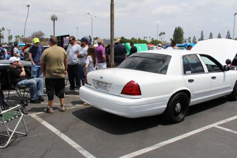 White Ford full-size sedan parked rear-three-quarter at a car show