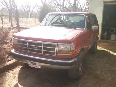 1992 Ford Bronco - Front view of a red 1992 Ford Bronco.