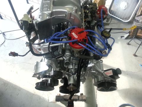 1994 Ford Bronco - Engine assembly with MSD distributor and blue spark plug wires. Supermotors.net logo visible.