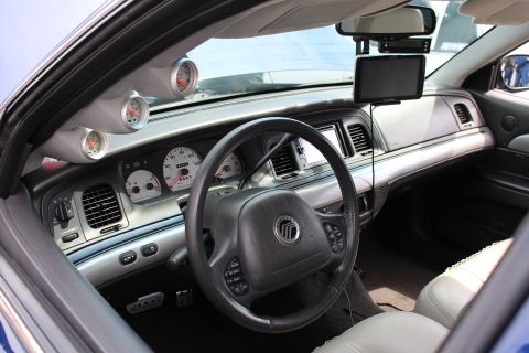 Sedan interior with Mercury steering wheel and added gauges